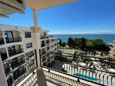 a balcony of a building with a view of the ocean at Luxury Penthouse Apartments at Valencia Gardens in Burgas City