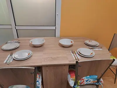a table with plates and utensils on it at ПРИНЦЕС in Burgas City