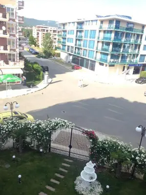 a view of a street with a fence and flowers at Plush, 1 Bed Apt, Dawn Park D in Sunny Beach