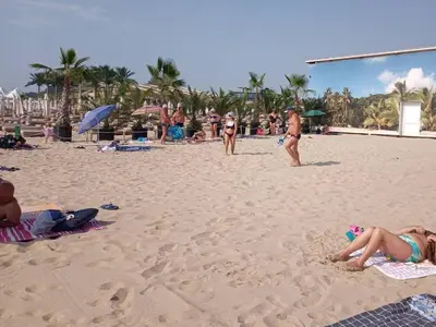a group of people on a sandy beach at Комплекс Элит 4 Несебр/Солнечный берег in Sunny Beach