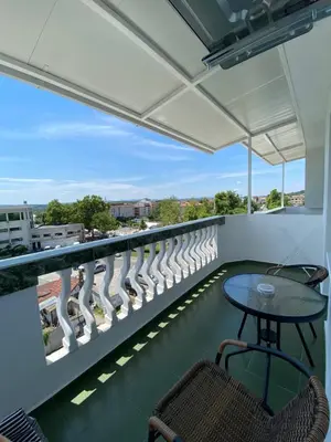 a balcony with a table and chairs and a view at Your Room Primorsko in Primorsko