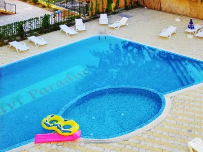 a large swimming pool with a yellow inflatable at Residence Livi Paradise Sunny Beach! 2 plus 1 - 600m away from the beach in Sunny Beach