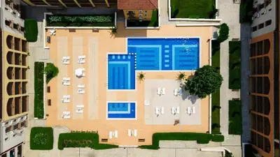 an overhead view of a building with a swimming pool at Чудесно място с басейн 
