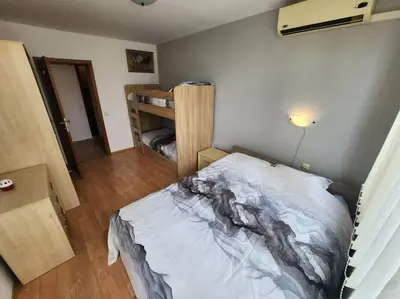 a bedroom with a bed and a bunk bed at Modern 1 Bed Apt, Nesebar Fort in Sunny Beach