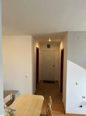 a dining room with a table and chairs and a door at Modern 1 Bed Apt, Nesebar Fort in Sunny Beach