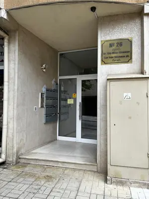 an entrance to a building with a glass door at Green Central Apartment in Varna City