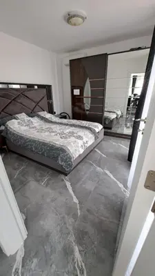 a bedroom with a bed and a large mirror at Diamond Beach Luxus Apart Obzor 28 in Obzor